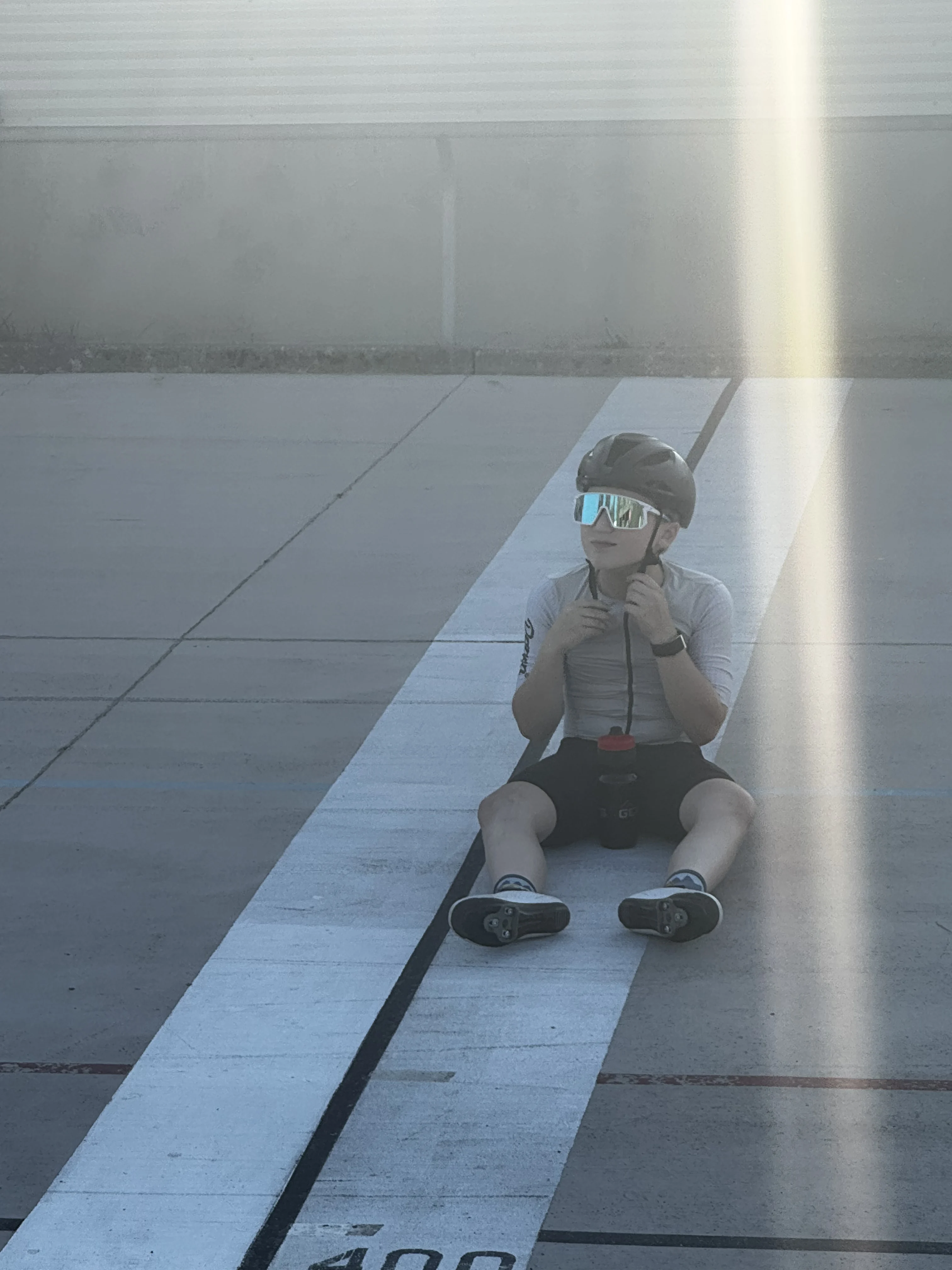 Leo Wilssens seated beside the velodrome track
